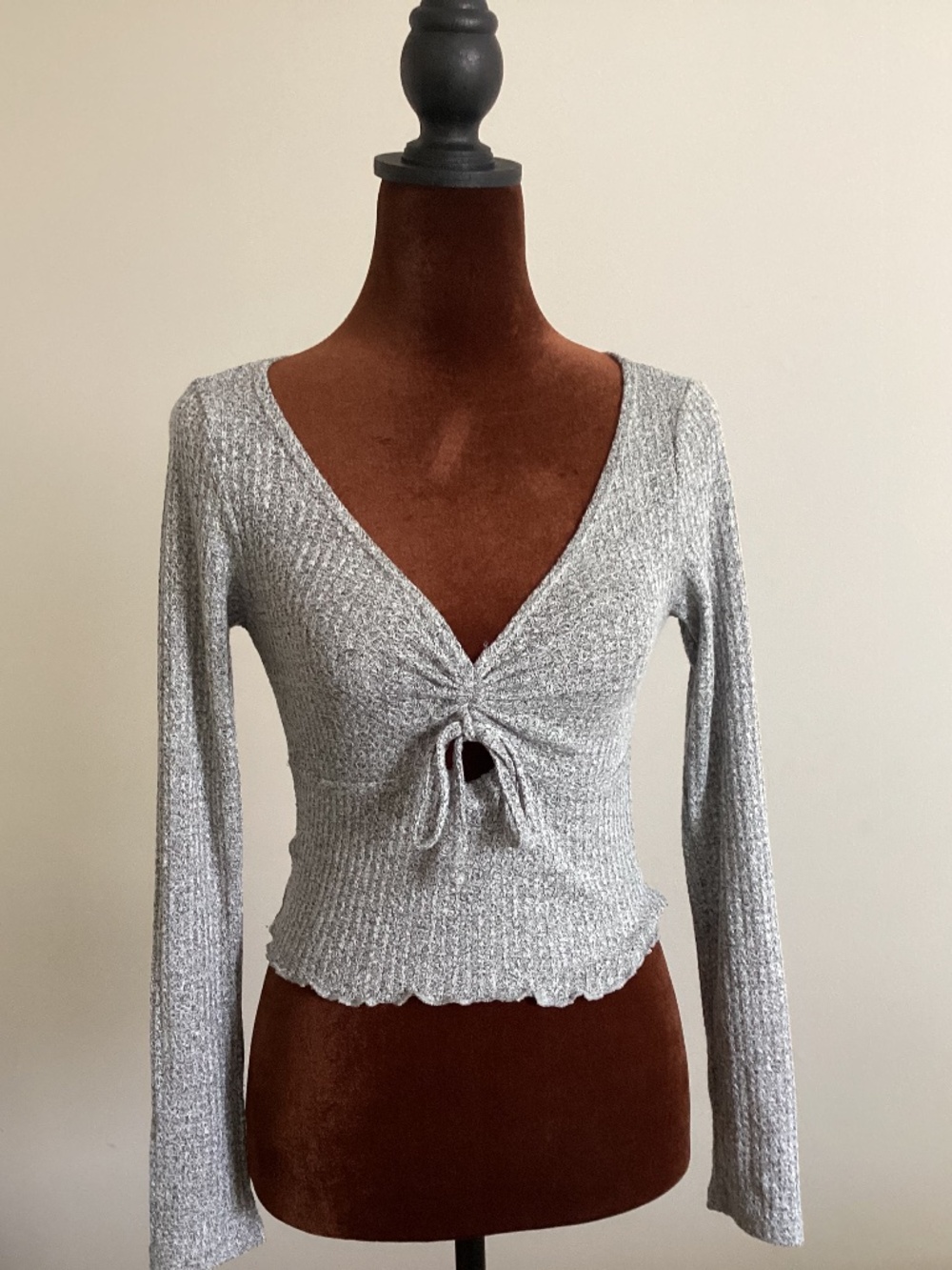 Long sleeve frilly hem key hole tie front